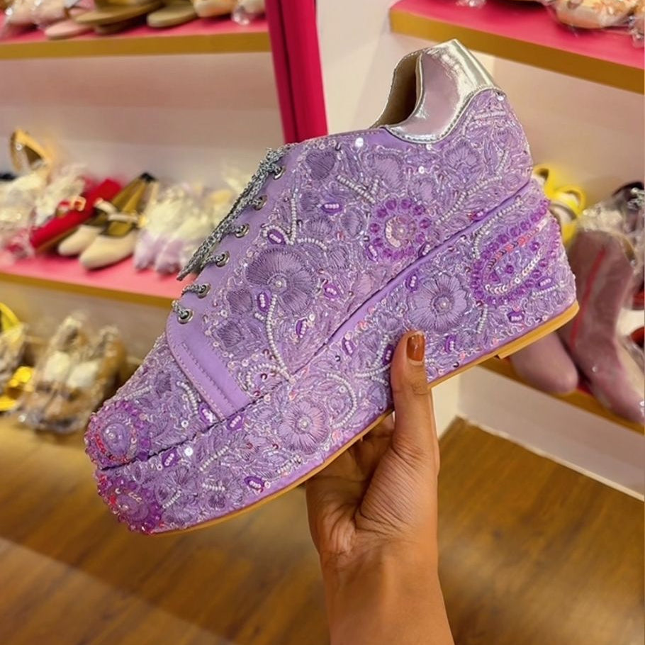 Purple sneaker with decorative patterns
