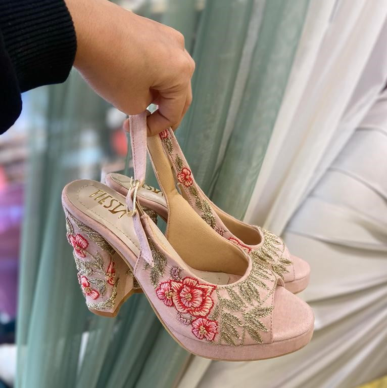 Photo of Sparkly heels against bridal lehenga